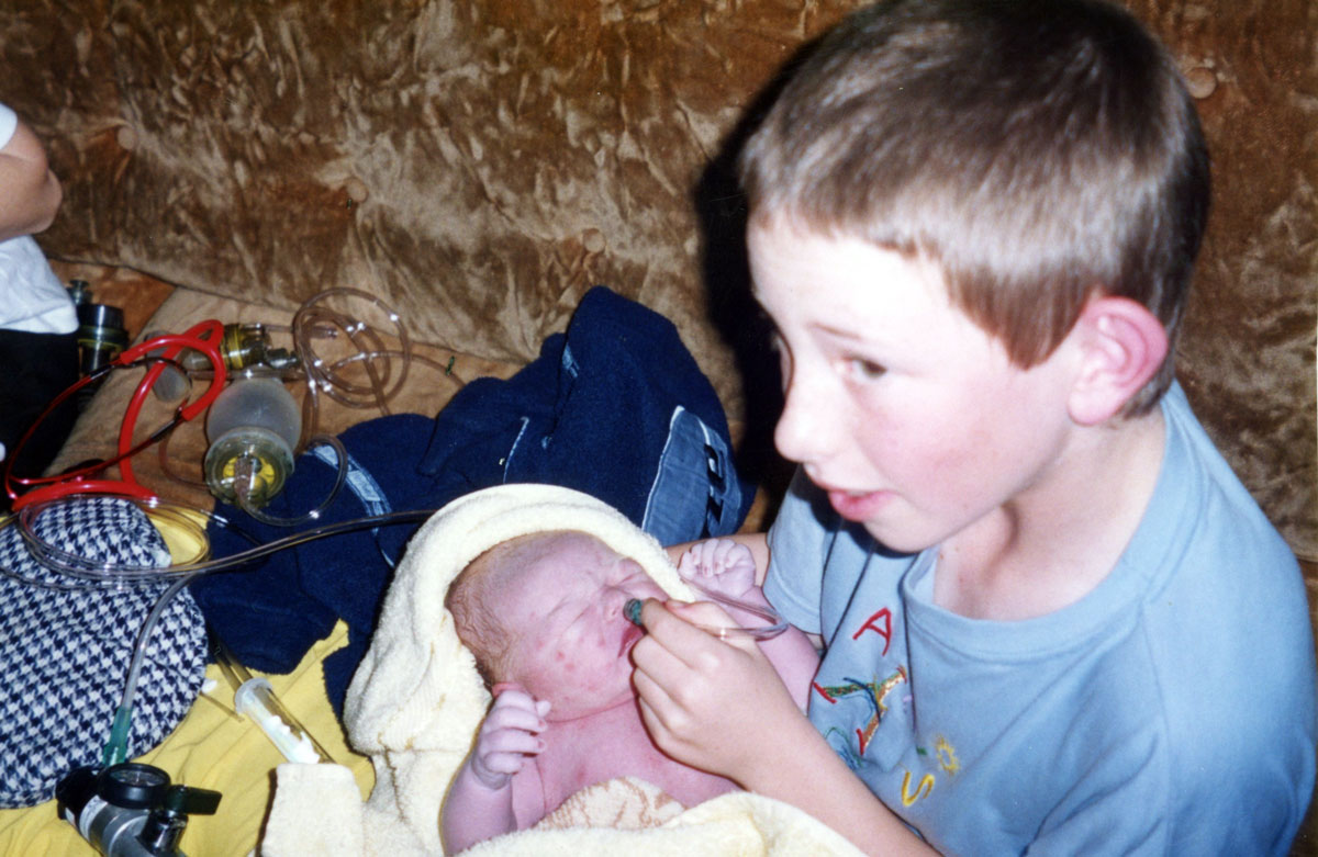 Joshua holding jarred