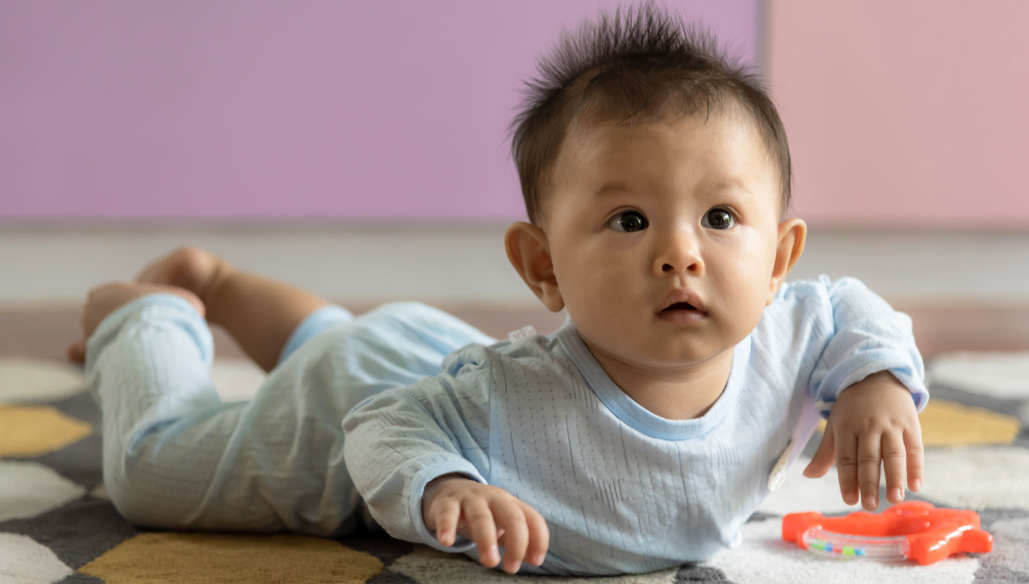 Asian baby on tummy cute