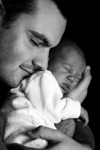 Dad cuddling a baby